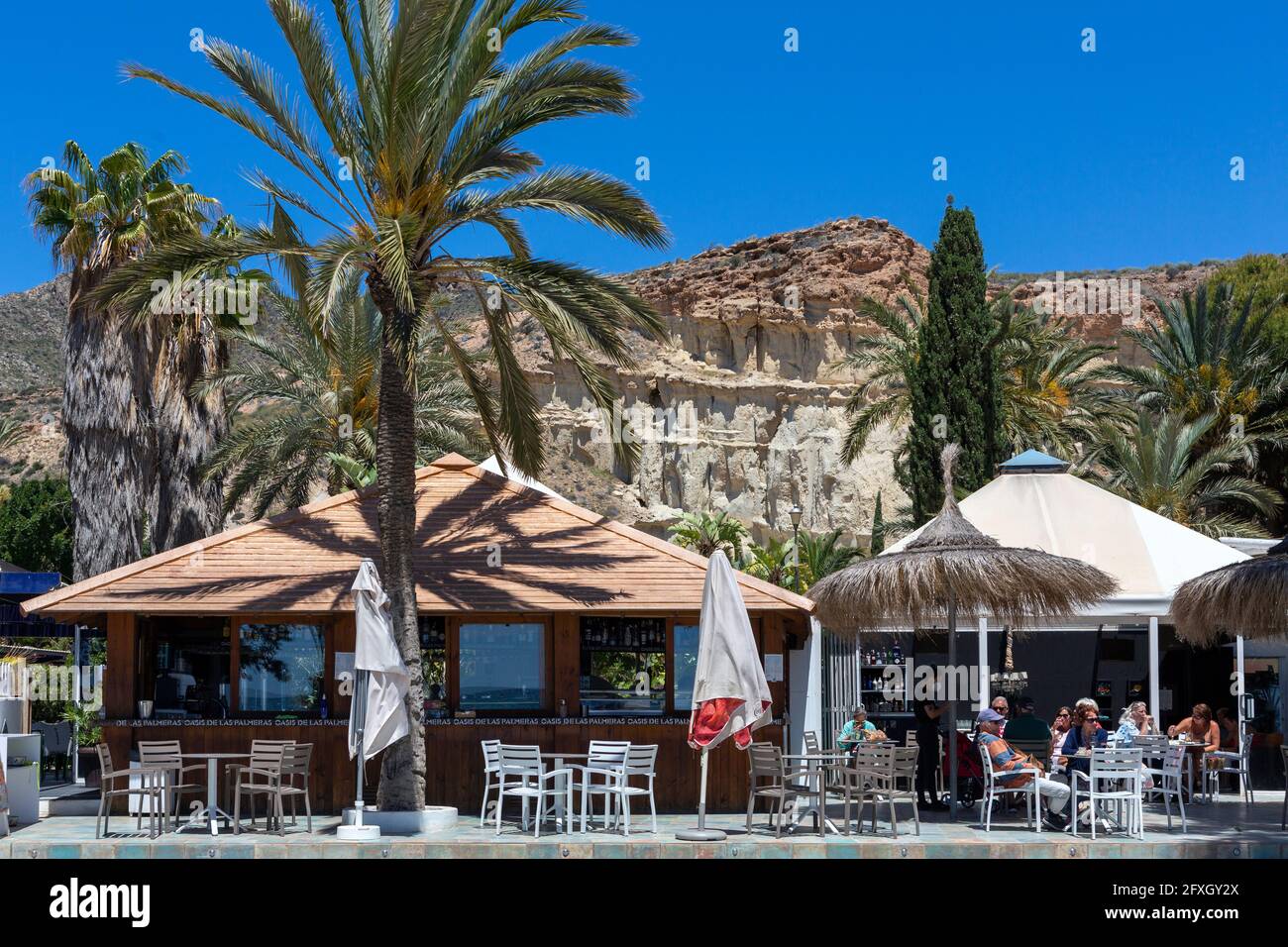 Bolnuevo, Murcia, Spain 11-05-2021 Bar restaurant Oasis de las Palmeras, on the beachfront with terrace on sunny days, especially for tourists. Stock Photo