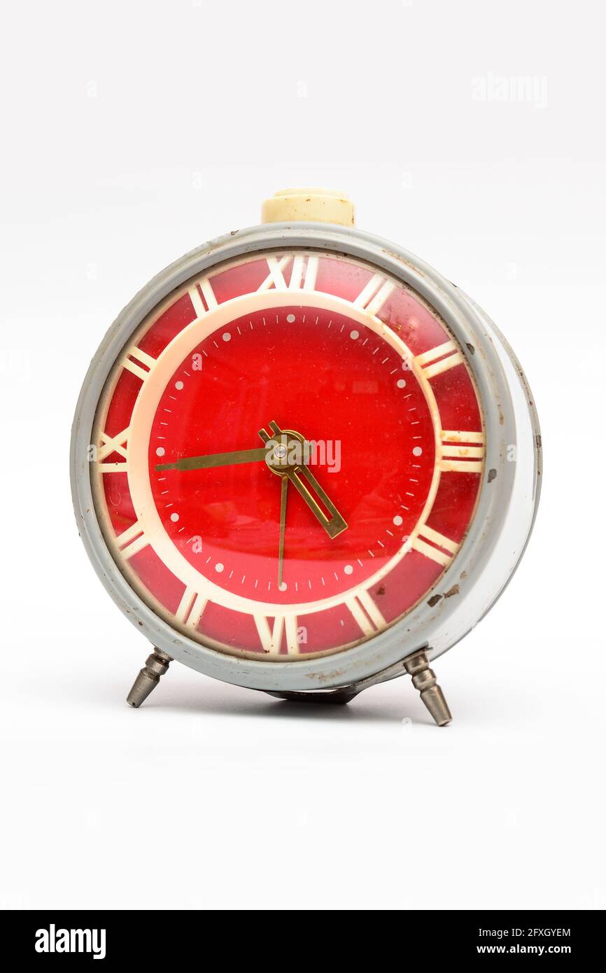 Old mechanical alarm clock on white background Stock Photo - Alamy