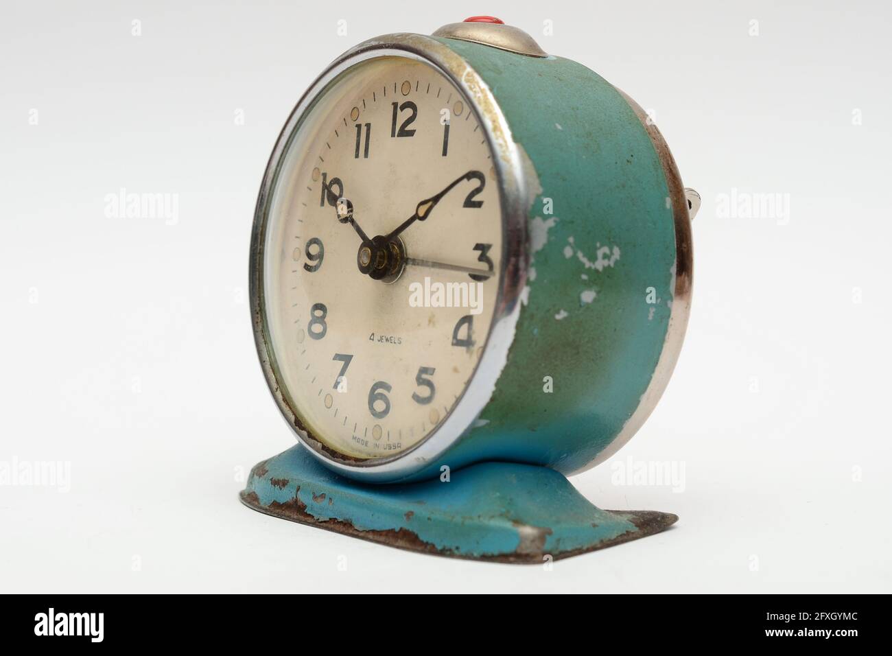 Old mechanical alarm clock on white background Stock Photo - Alamy