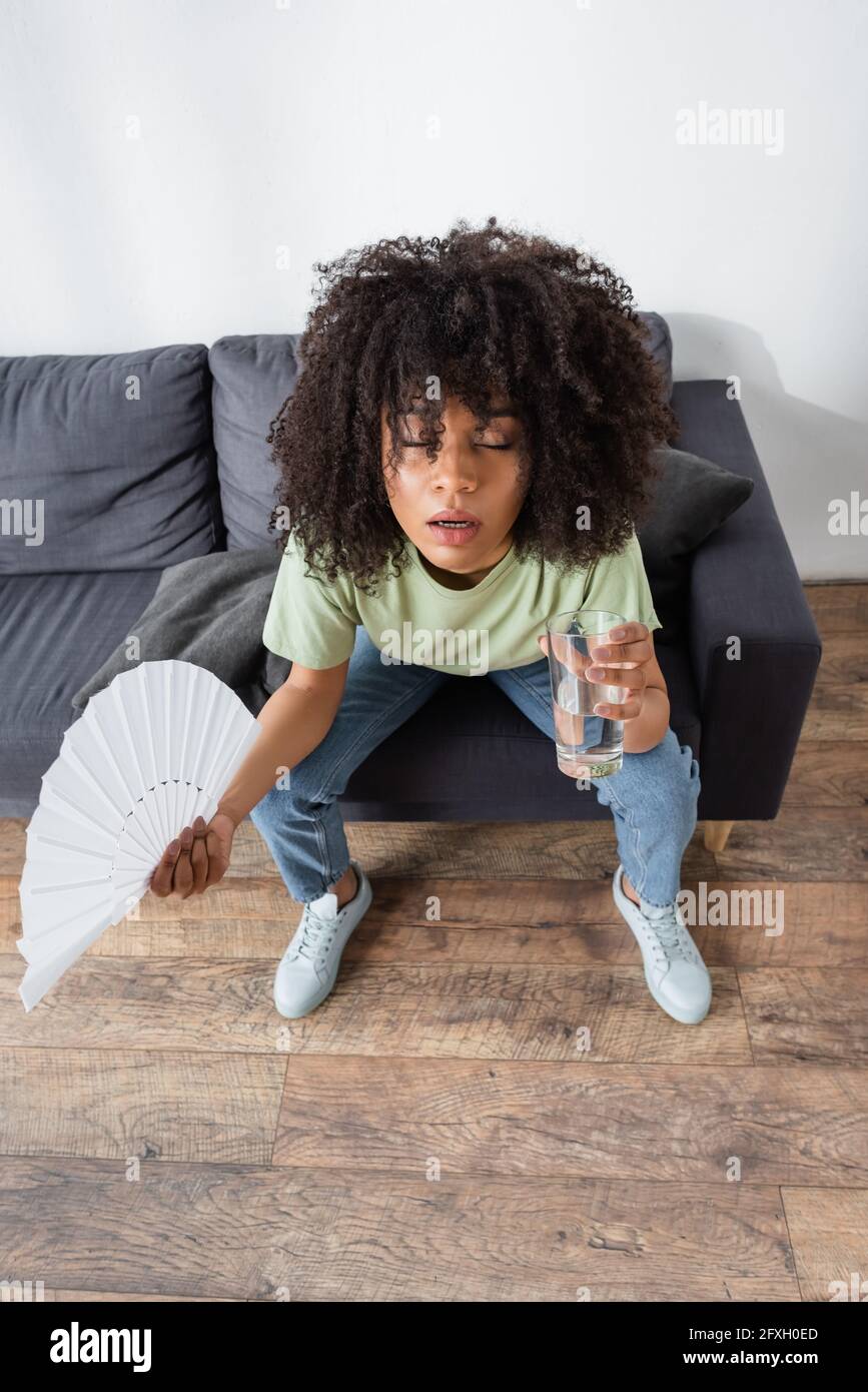 People Using Handheld Fan Using Hand Fan