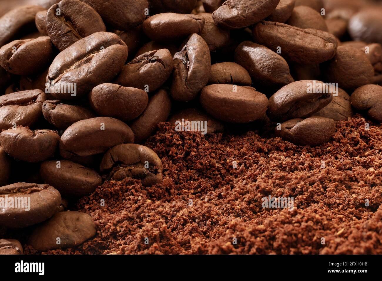 macro of roasted coffee beans and ground coffee Stock Photo - Alamy