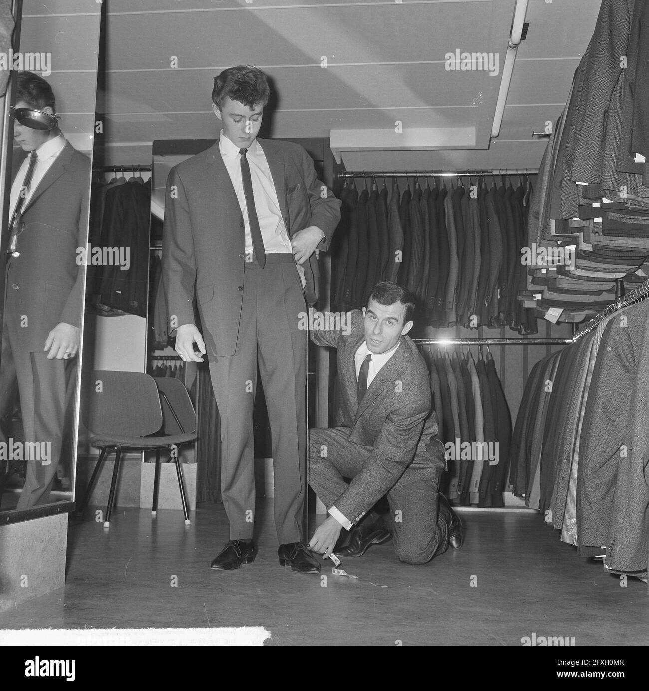 Soccer player Coen Moulijn in his menswear store, December 12, 1964, clothing, costumes, stores, The Netherlands, 20th century press agency photo, news to remember, documentary, historic photography 1945-1990, visual stories, human history of the Twentieth Century, capturing moments in time Stock Photo