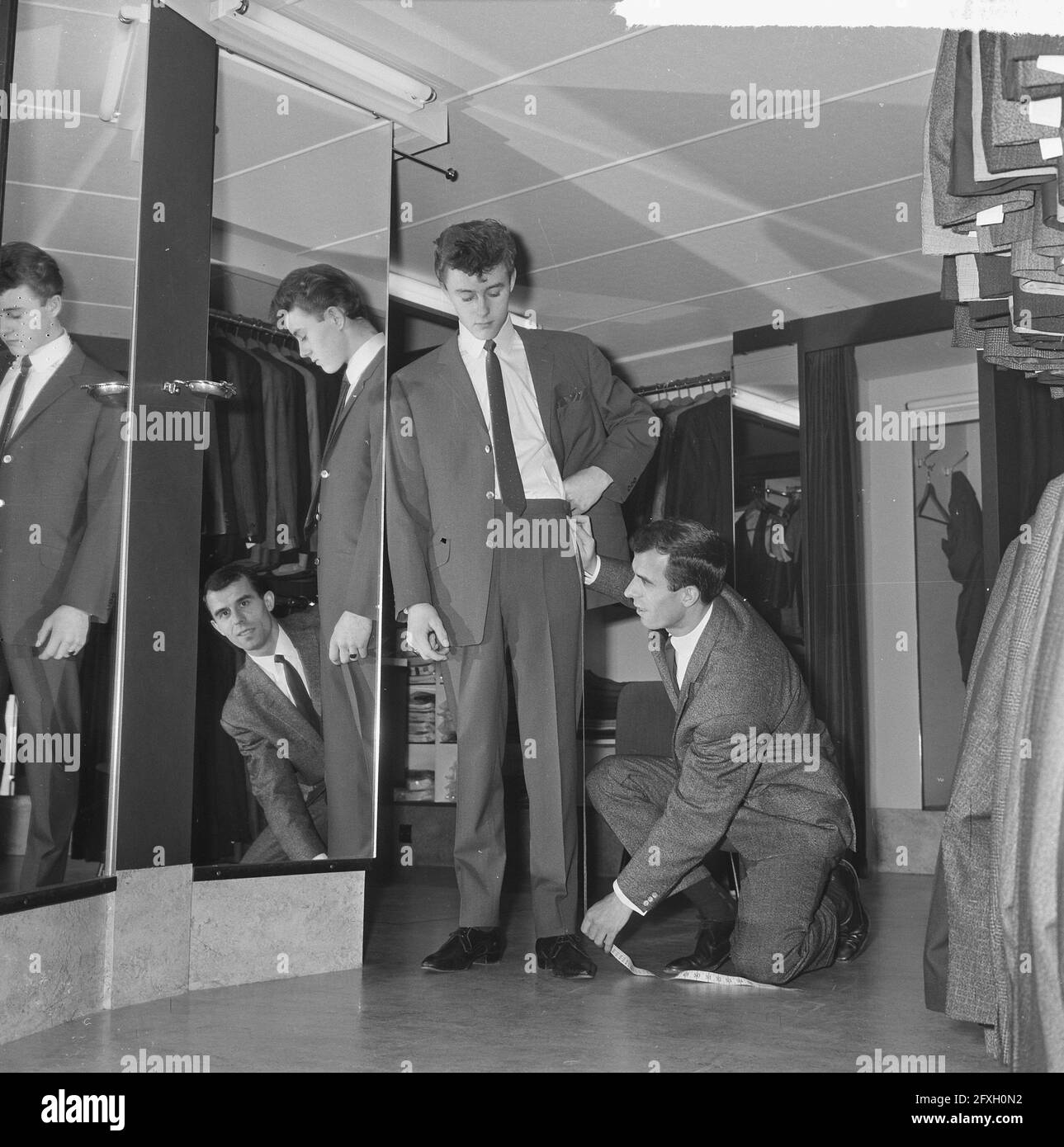 Soccer player Coen Moulijn in his menswear store, December 12, 1964, clothing, costumes, stores, The Netherlands, 20th century press agency photo, news to remember, documentary, historic photography 1945-1990, visual stories, human history of the Twentieth Century, capturing moments in time Stock Photo
