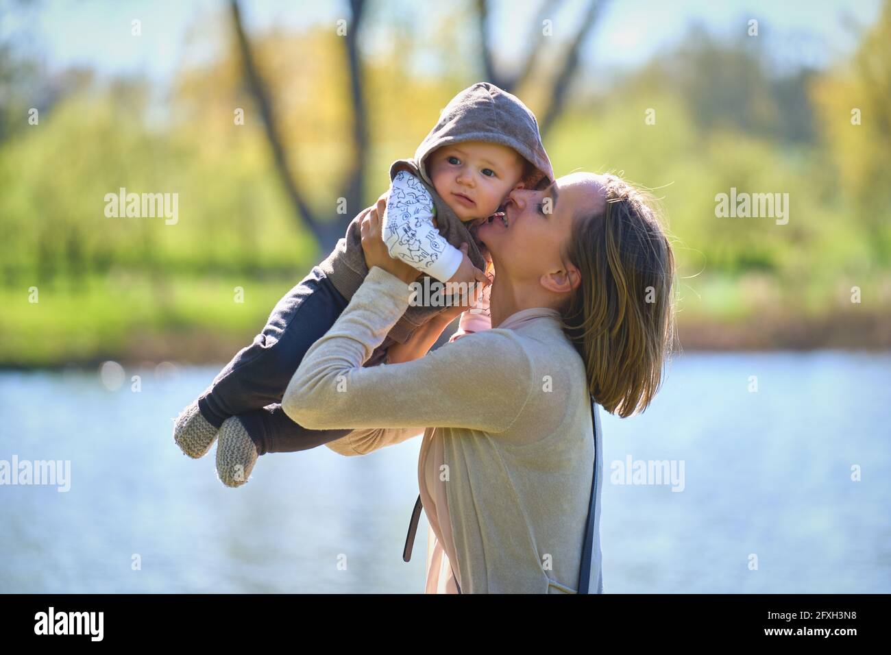 Mom throwing baby in air hires stock photography and images Alamy