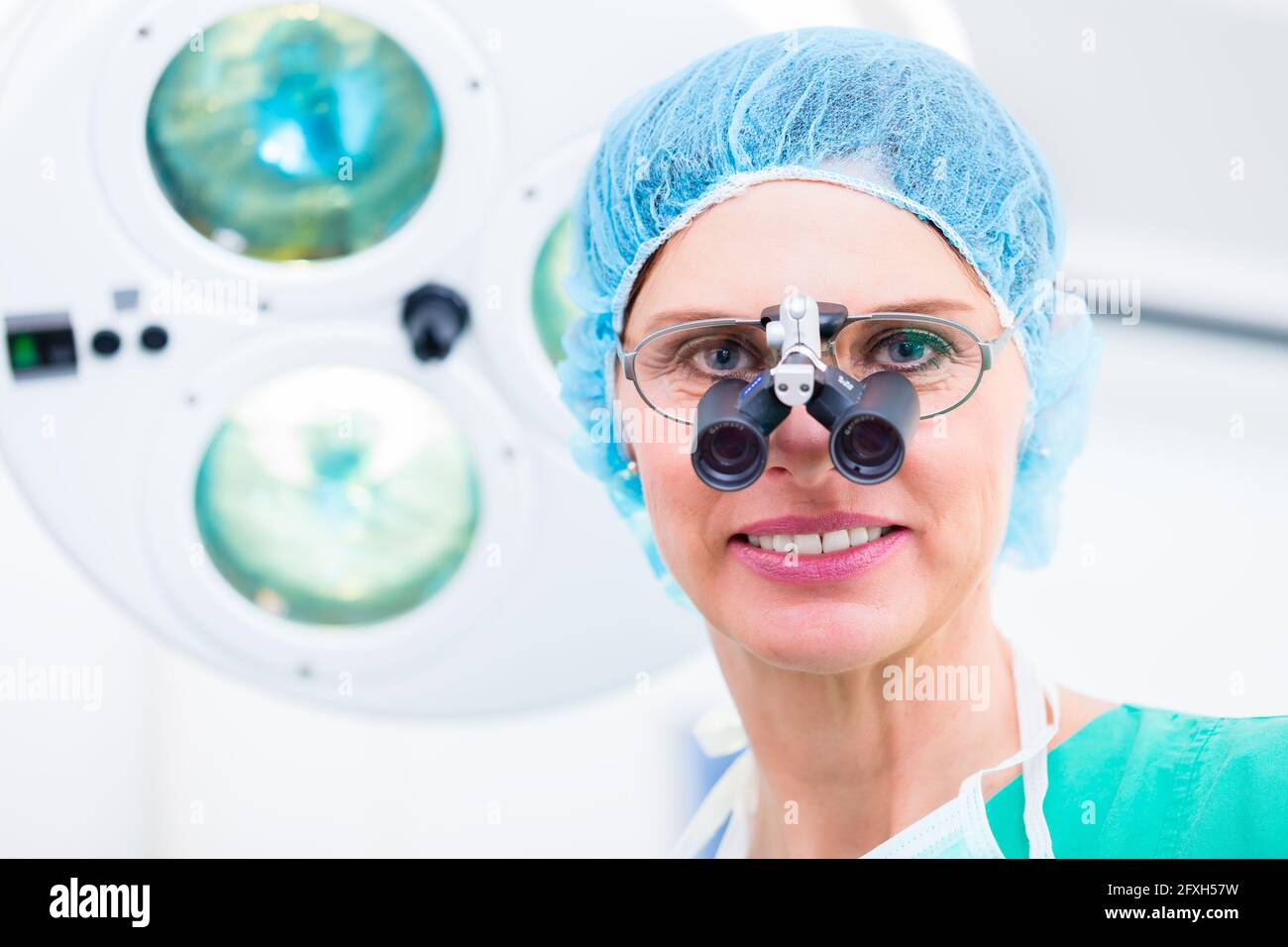 Orthopedic surgeon with special glasses in operating room Stock Photo