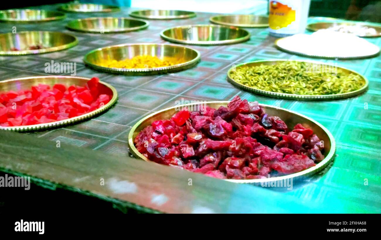 Ingredients of indian traditional meetha masala paan which is a mouth freshener and digestive. Sauf, tutti frutti, supari, clove, gulqand, coconut pow Stock Photo