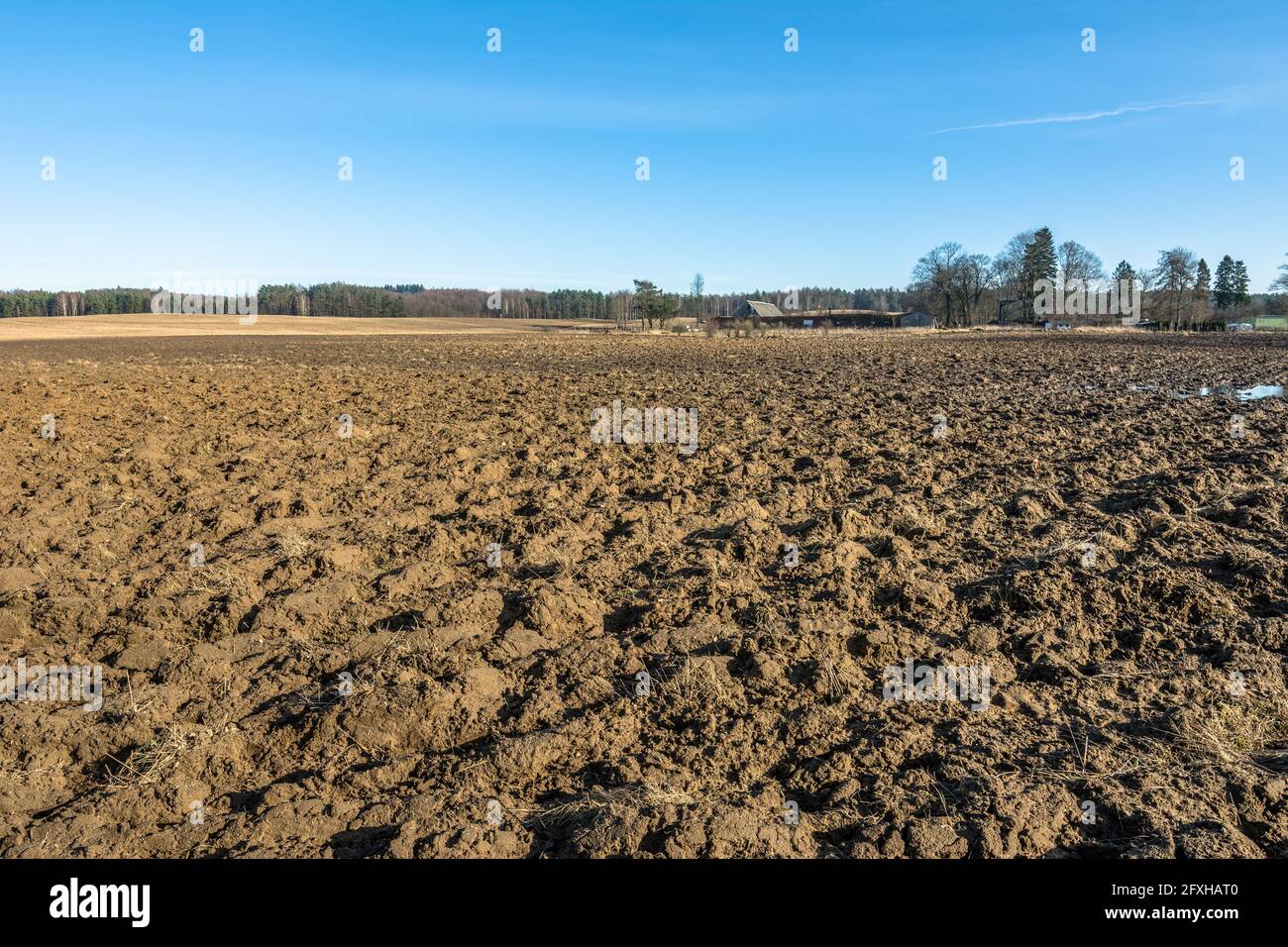 Early spring rural landscape with plowed field under blue sky Stock ...