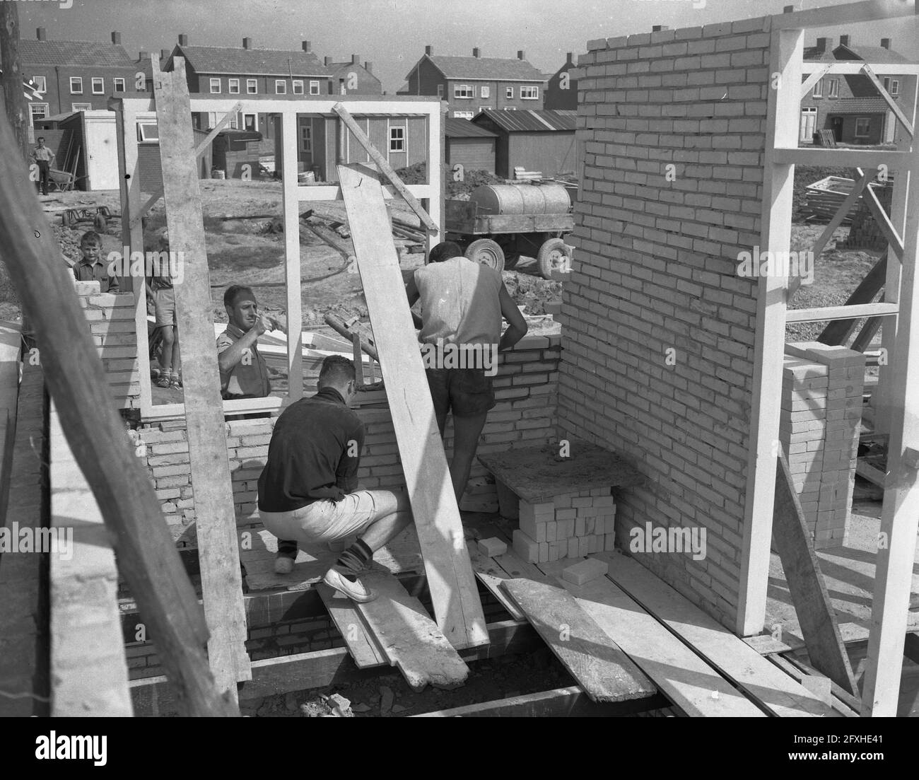 Volunteers including foreign youngsters help construction in Zeeland, at Nieuwerkerk Schouwen Duiveland, August 30, 1955, FREEWILLERS, The Netherlands, 20th century press agency photo, news to remember, documentary, historic photography 1945-1990, visual stories, human history of the Twentieth Century, capturing moments in time Stock Photo