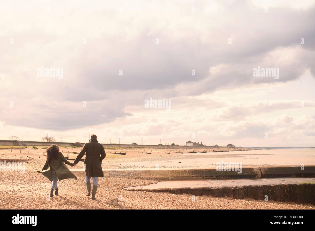 Couple holding hands walking hi-res stock photography and images - Alamy