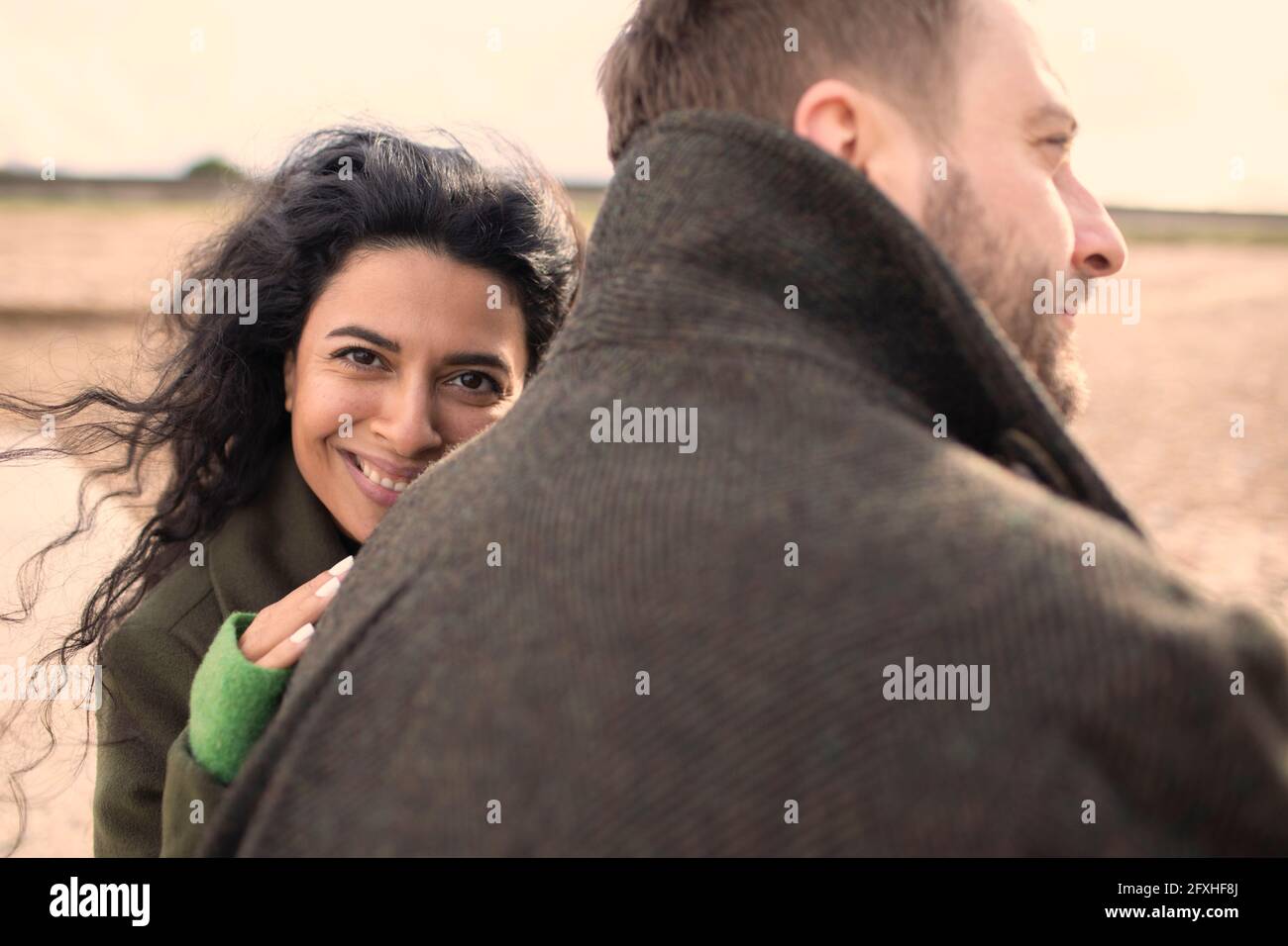 Portrait happy affectionate couple in winter coats Stock Photo
