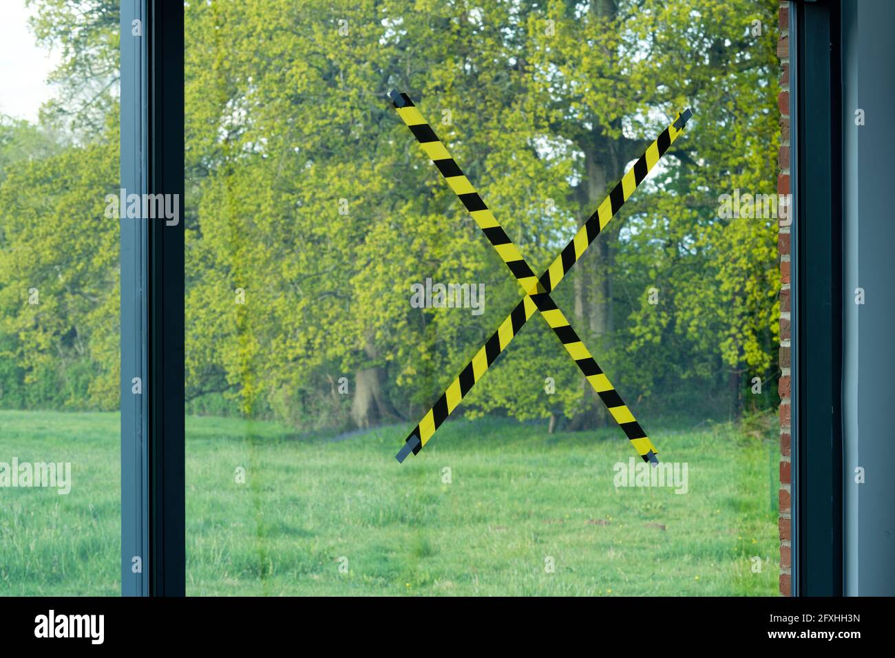 Tape stuck onto a glass window to stop children and adults bumping in