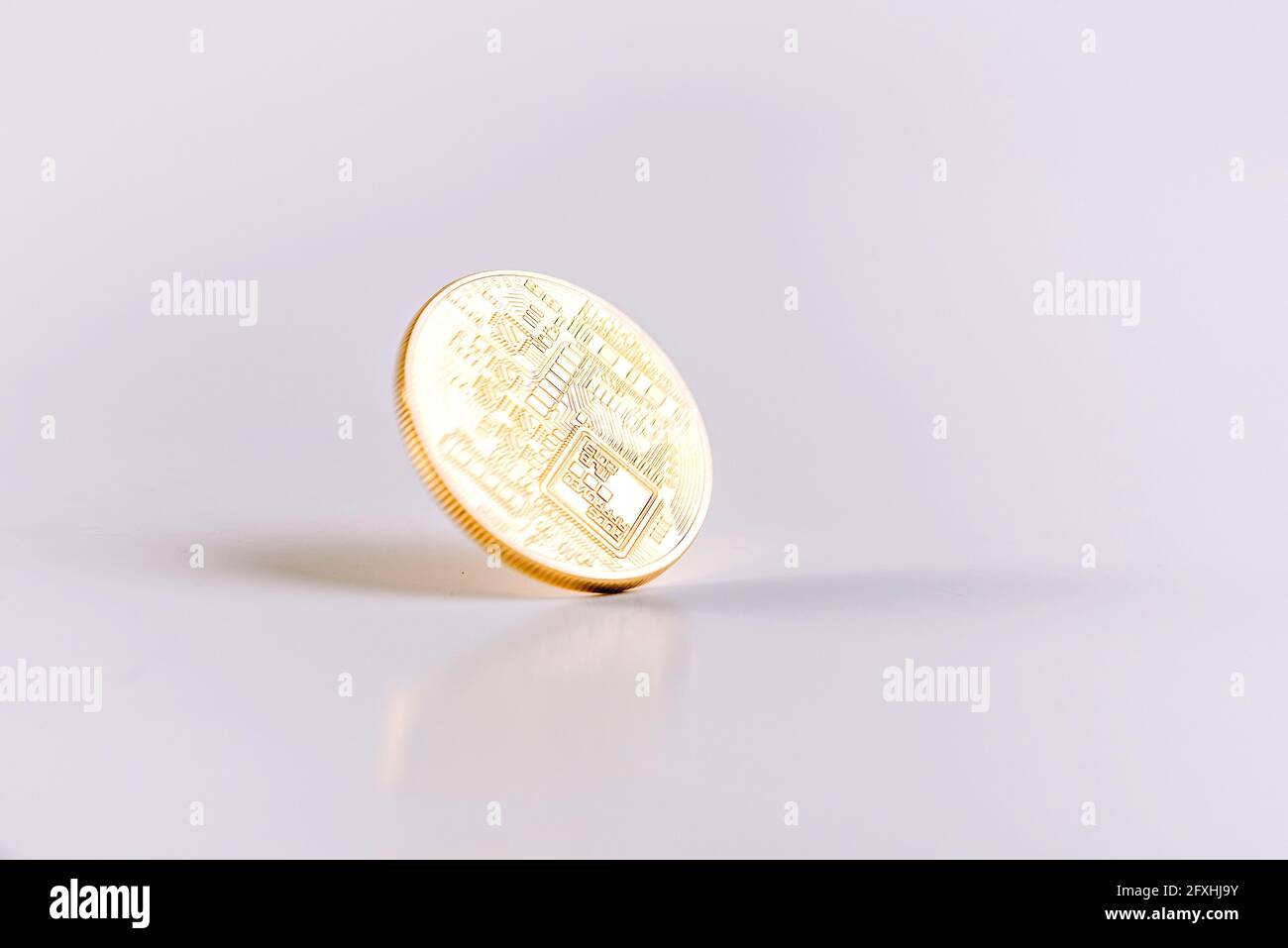 Reverse Of A Bitcoin Coin Spinning On A White Table. Copy Space. White  Background. Isolated. Falling Market Concept Stock Photo - Alamy