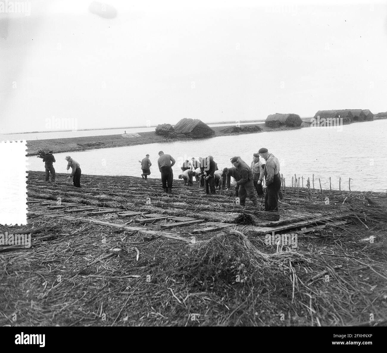Sluiceworks Work on sluice works Lelystad, reinforce dike, October 31, 1955, dikes ...