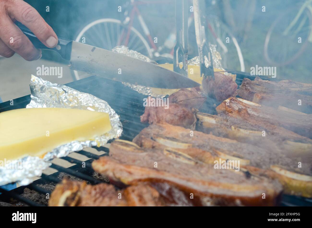 Closeup shot of provolone cheese and meat cooking on the grill at a street  Stock Photo - Alamy