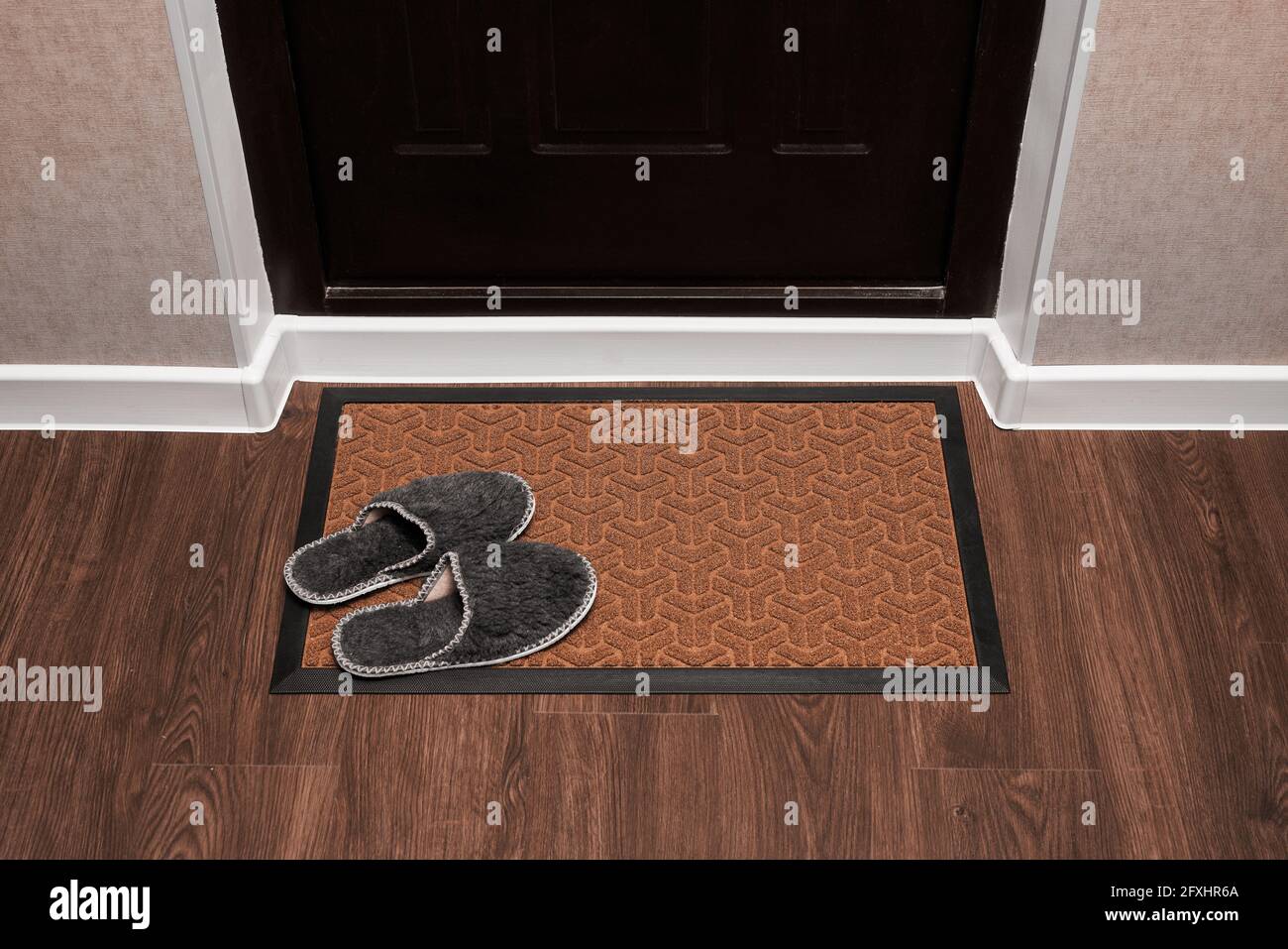 Blank Doormat Before The Dark Door In The Hall Home Slippers On The Rug Top View Of Mat On Wooden Floor Mockup For Your Design Stock Photo Alamy