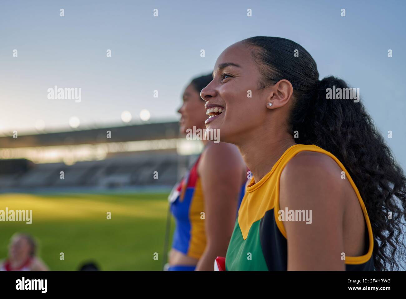 Happy female track and field athlete laughing Stock Photo