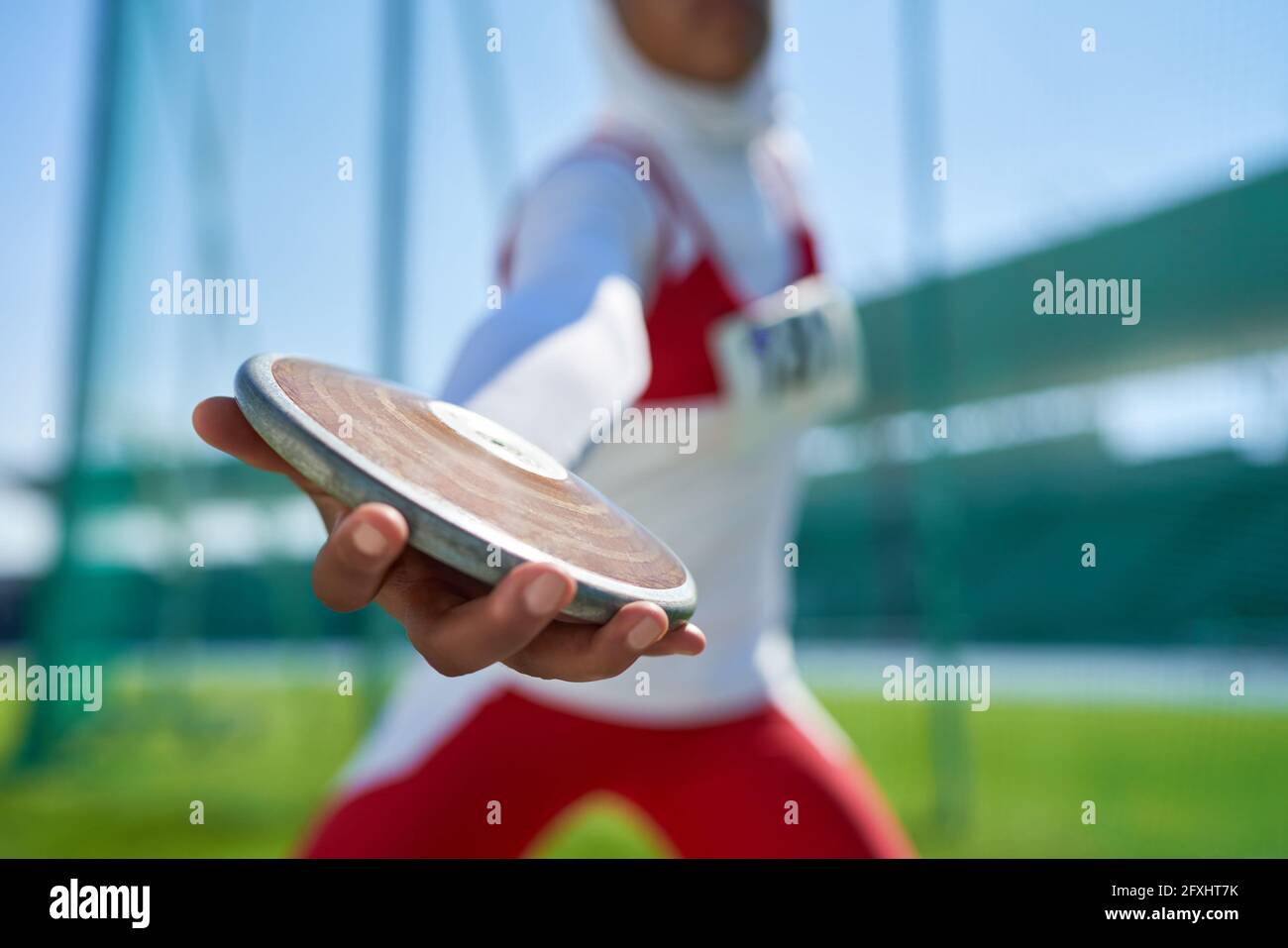 Close up female track and field athlete throwing discus Stock Photo Alamy