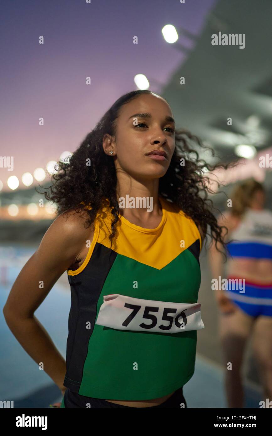 Determined track and field athlete preparing for competition Stock Photo