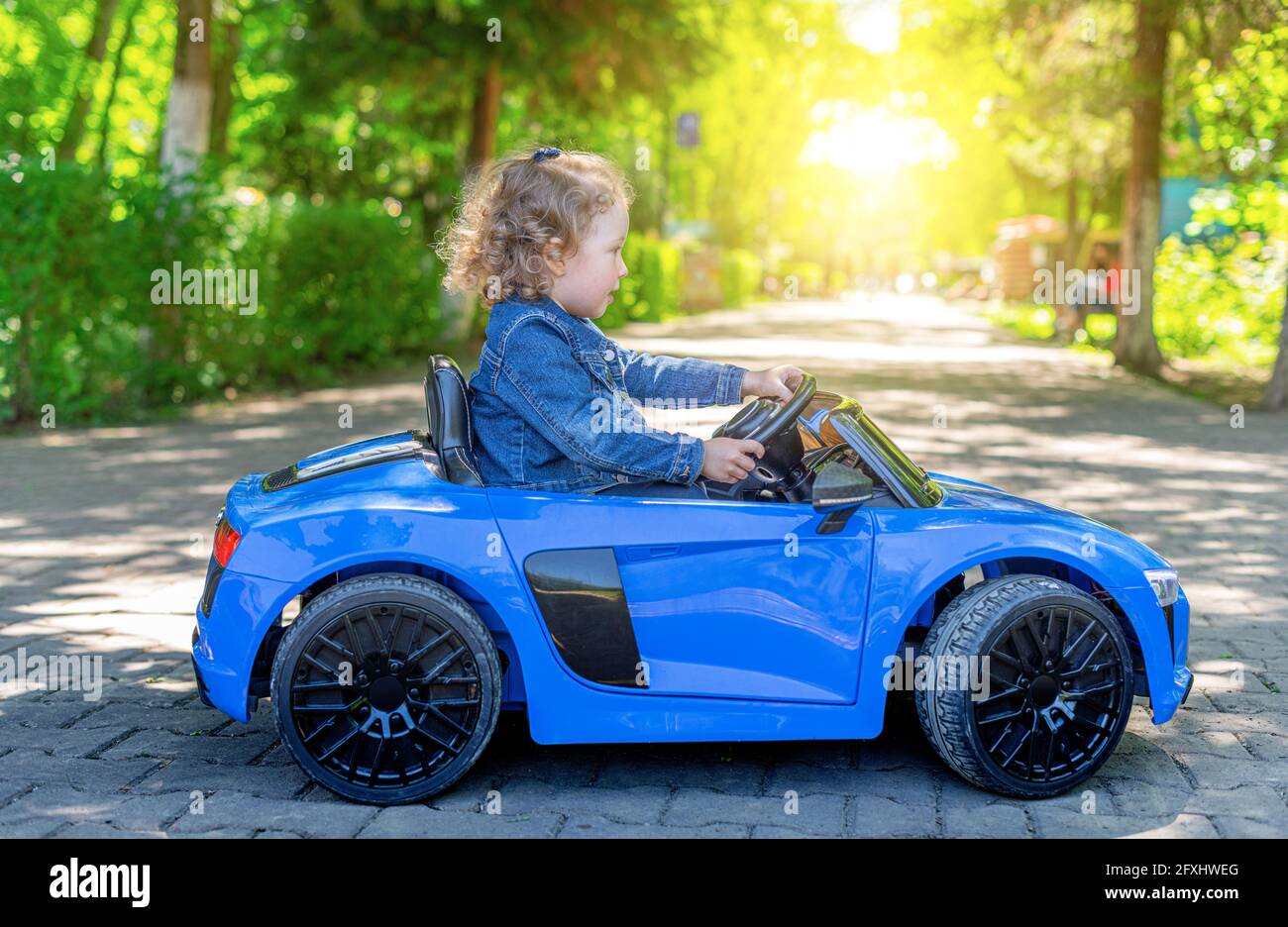 Kid driving wheel hires stock photography and images Alamy
