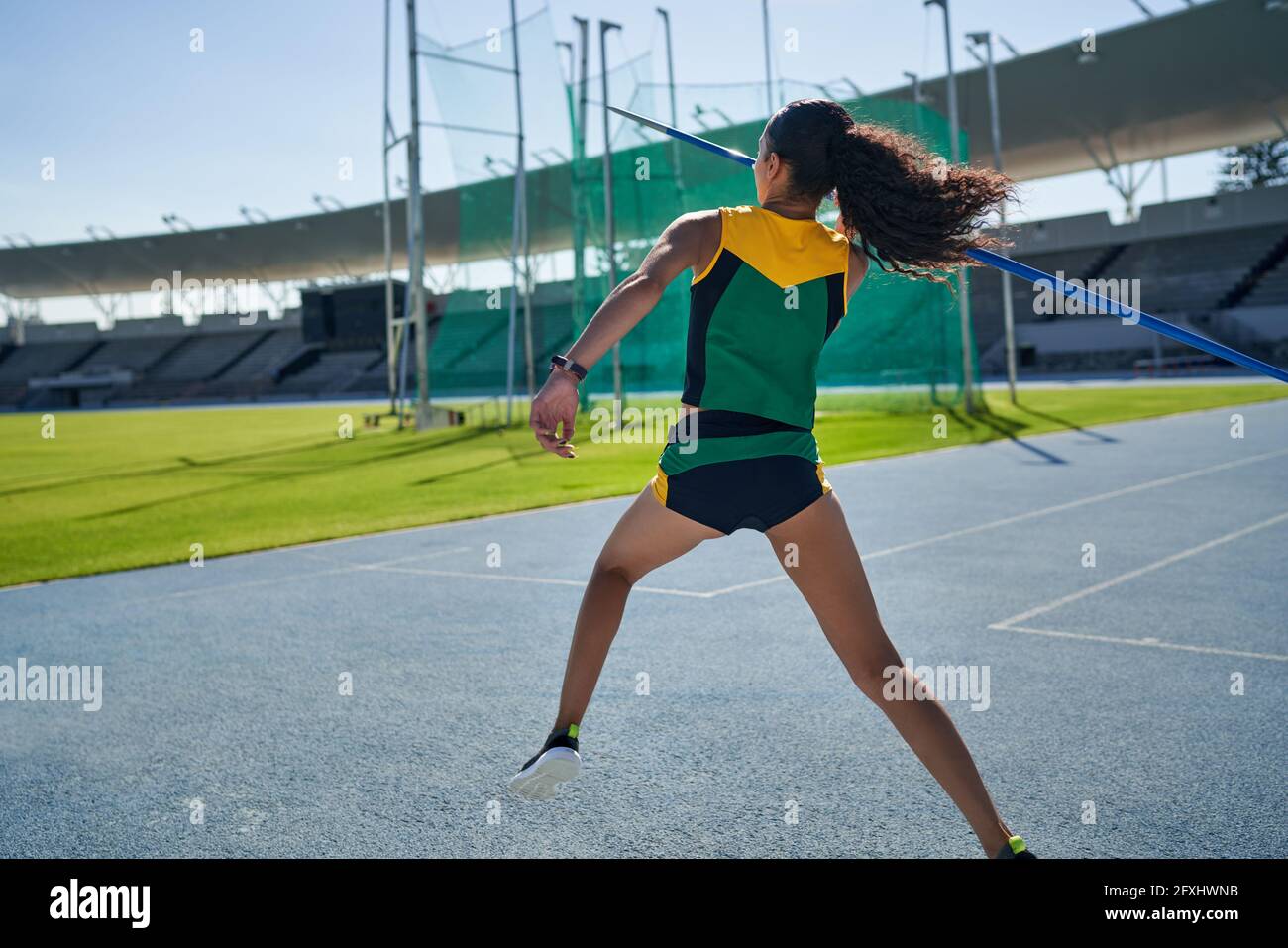 Female track and field athlete throwing javelin Stock Photo Alamy