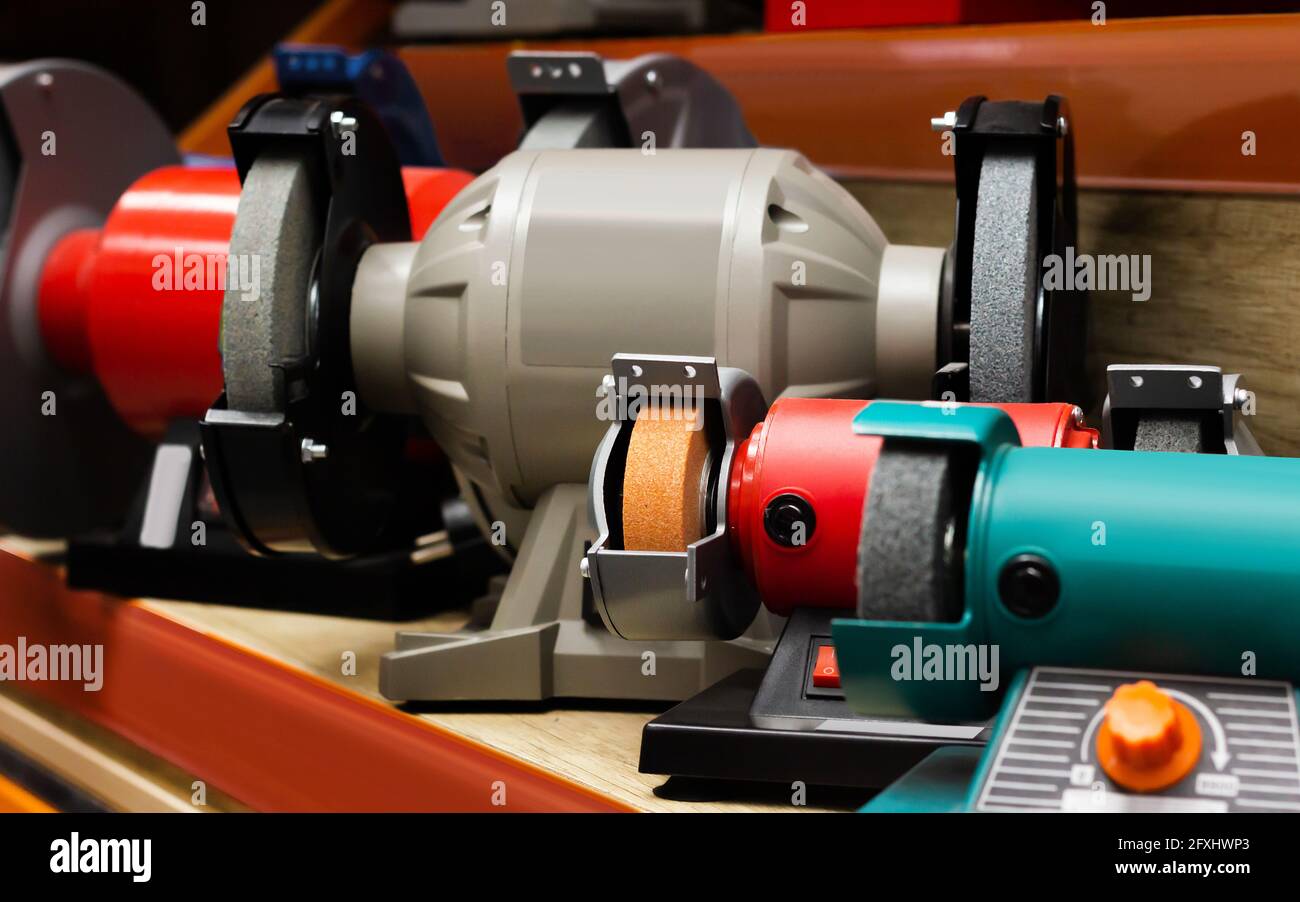 Photo of various type table grinder tools standing on construction