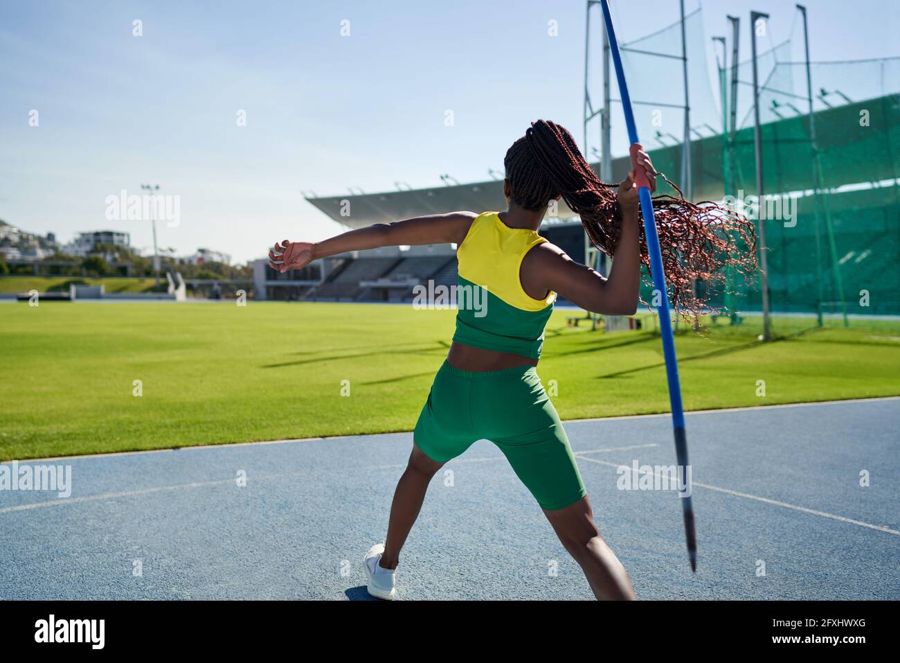 Female track and field athlete throwing javelin Stock Photo Alamy