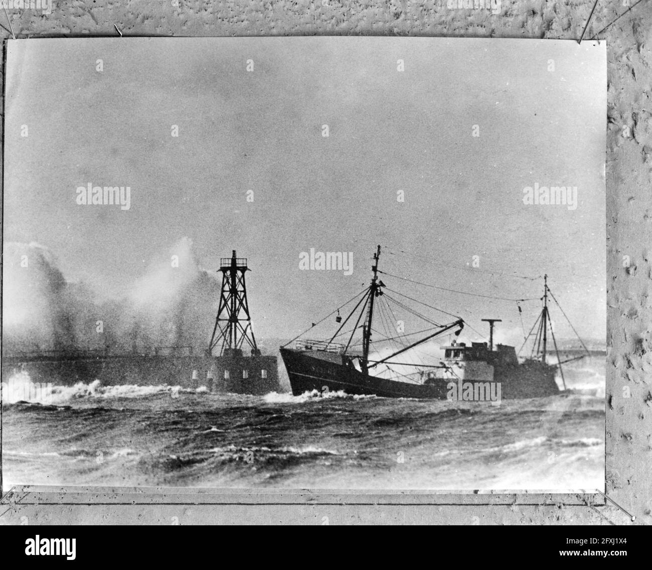 Wind force 10, fishing boat enters harbor of Scheveningen, February 23,  1967, Fishing boats, harbors, The Netherlands, 20th century press agency  photo, news to remember, documentary, historic photography 1945-1990,  visual stories, human
