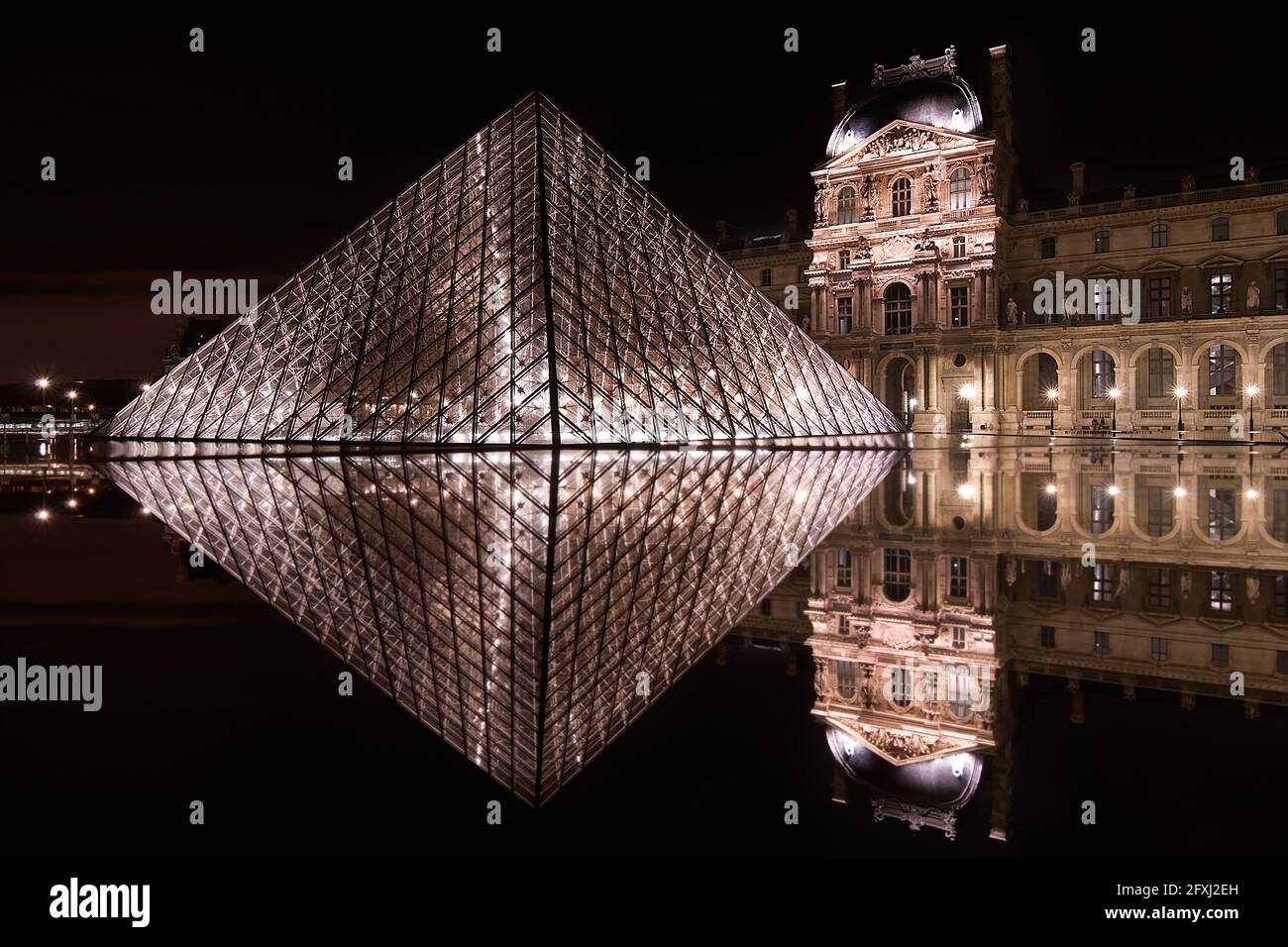 Pyramid In France FRANCE, PARIS (75) LOUVRE PYRAMID IN THE EVENING WITH THE REFLECTION OF ...