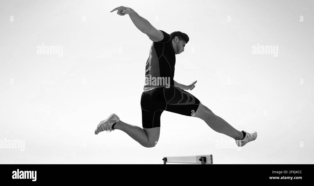 Composition of male hurdle jumper with copy space in black and white Stock Photo