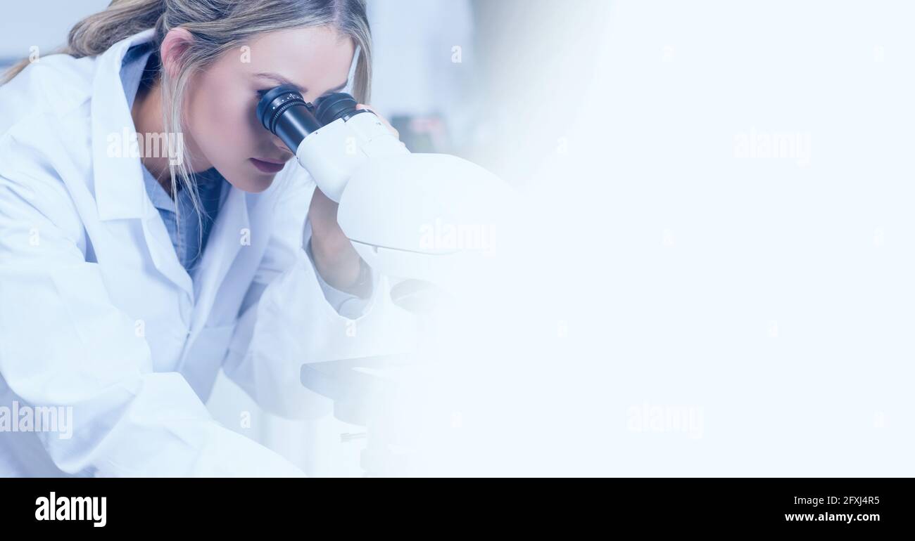 Composition of female lab technician using microscope, with white ...