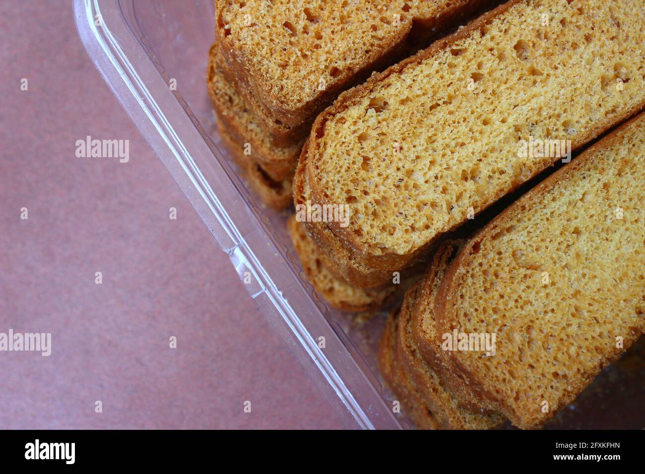 Rusk toasts in plastic box Stock Photo - Alamy