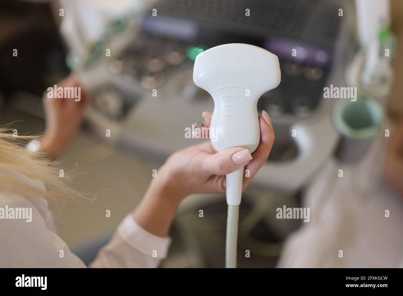 In doctor hand, equipment for ultrasound examination of internal organs Stock Photo