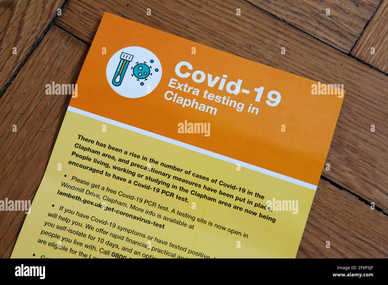 London, UK, 27 May 2021: Due to cases of the India variant of coronavirus in a local school, homes in the area have been sent leaflets by Lambeth Council asking residents to take a PCR test. A temporary centre for collecting kits has been set up on Clapham Common's Windmill Drive. Anna Watson/Alamy Live News Stock Photo
