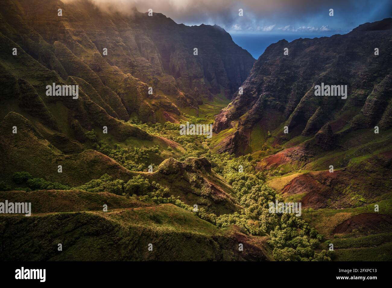 Flying through Nu'alolo Valley via helicopter in the evening on the NaPali Coastline, Kauai, Hawaii, United States of America, Pacific Stock Photo