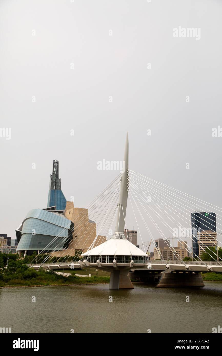 The Provecher Bridge crosses the Red River in Winnipeg, Canada. The bridge stands close to the Canadian Museum for Human Rights. Stock Photo
