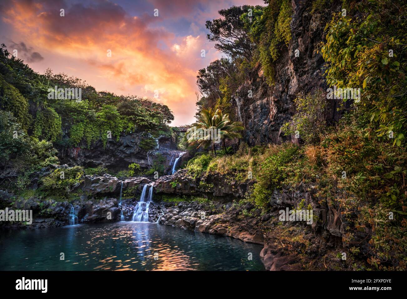 Sunset clouds float by over the Pools of 'Ohe'o (Seven Sacred Pools), Haleakala National Park, Maui, Hawaii, United States of America, Pacific Stock Photo