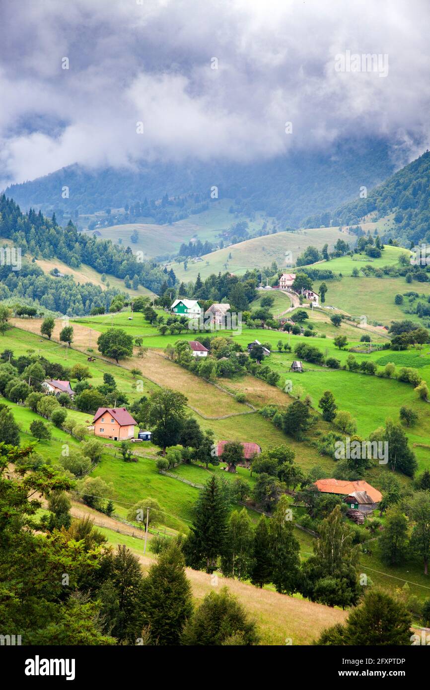 Rural landscape of Magura village, 1000 metres up in the mountains, in the Piatra Craiului National Park, Romania, Europe Stock Photo