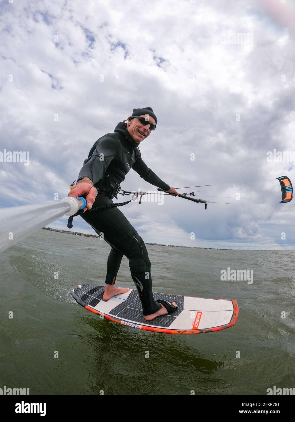 Photographer Skip Brown on his foiling kiteboard on the Pamlico Sound, Nags Head, North Carolina, United States of America, North America Stock Photo