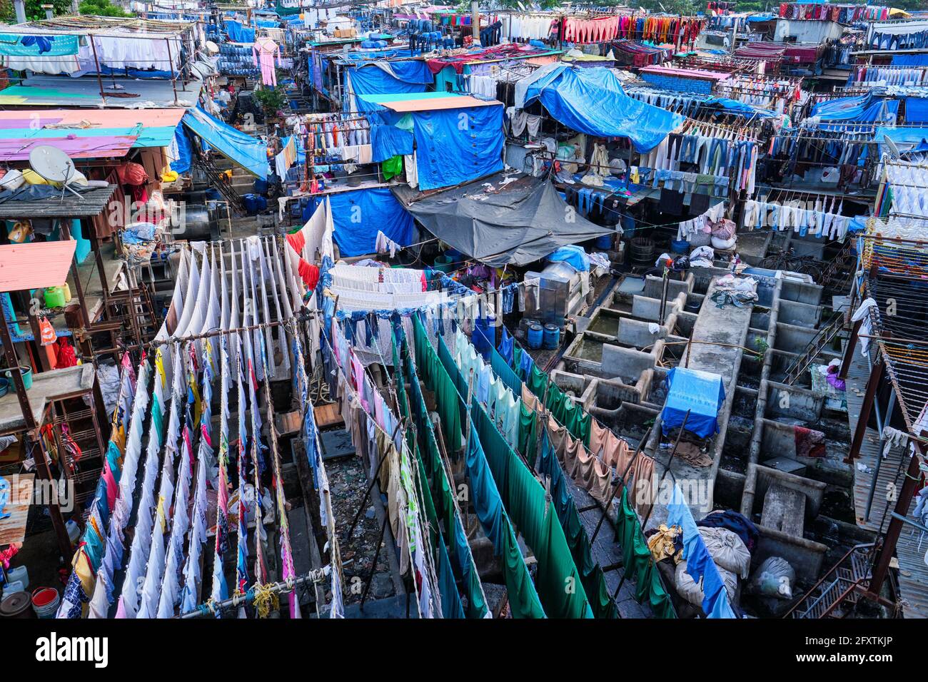 Dhobi Ghat is an open air laundromat lavoir in Mumbai, India with laundry drying on ropes Stock Photo
