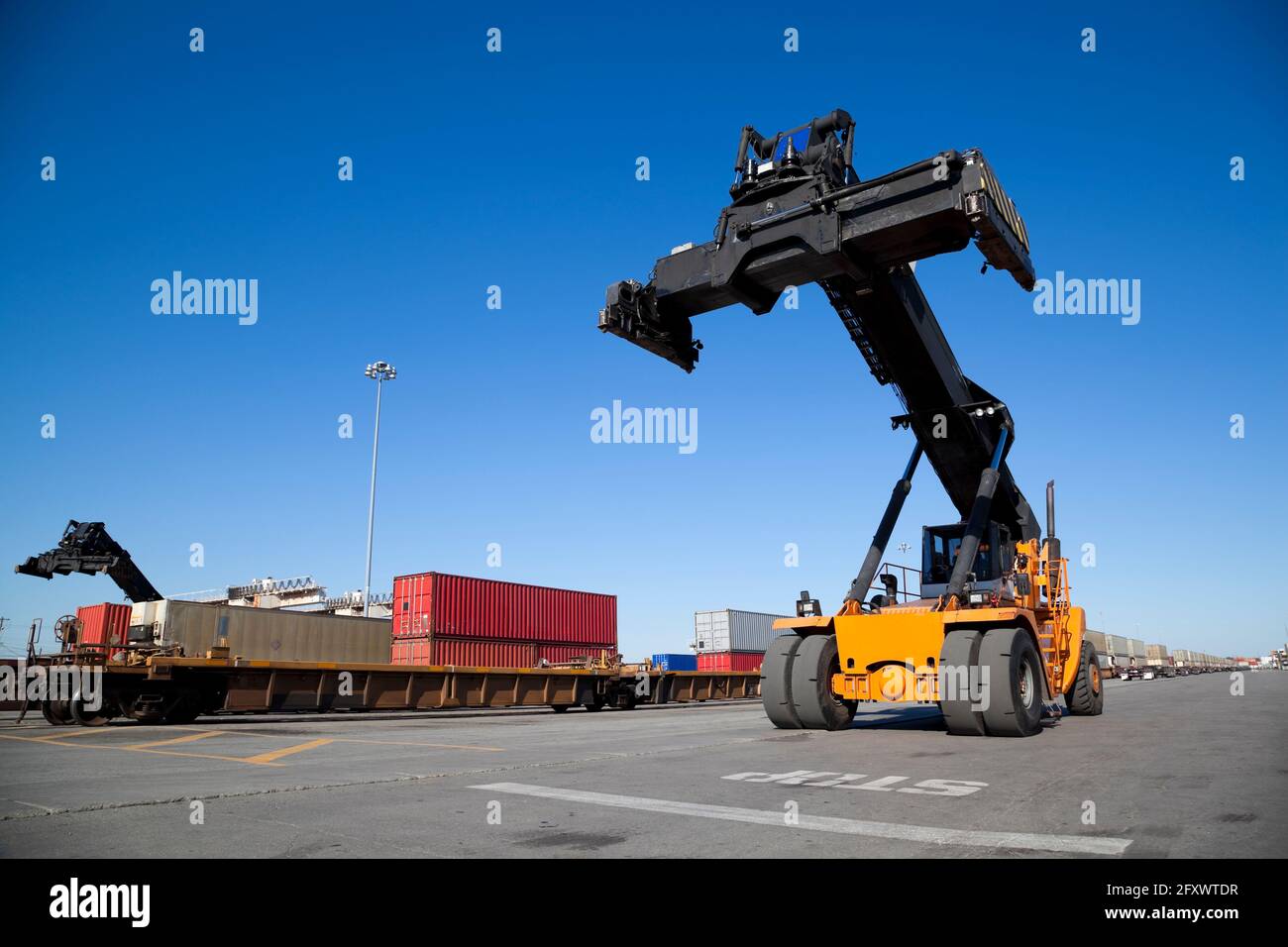 Mobile crane in train rail yard Stock Photo