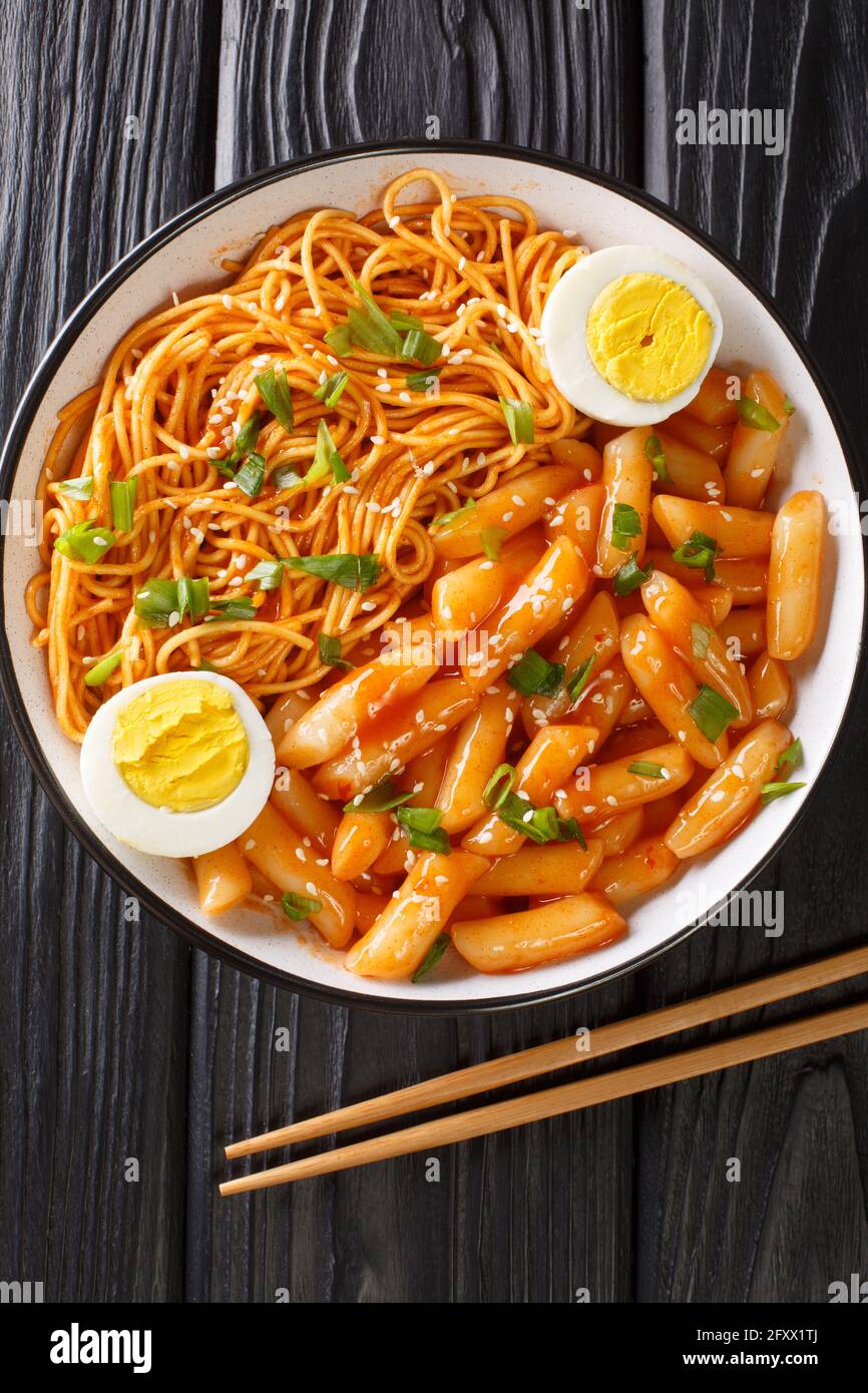 popular Korean snack meal Rabokki is all about spicy rice cakes and ramen  noodles closeup in the bowl on the table. Vertical top view from above  Stock Photo - Alamy