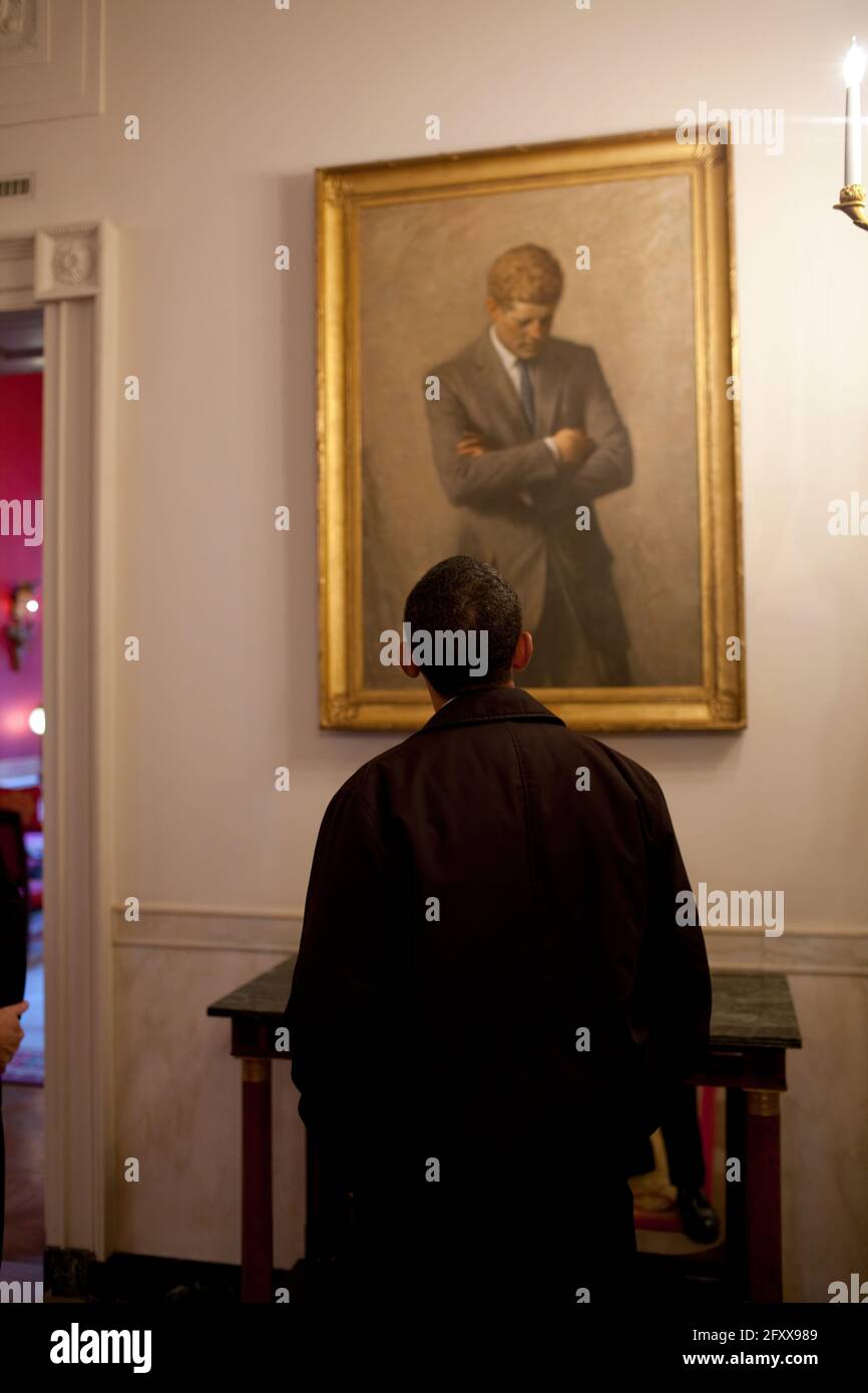 On a tour of the State Floor of the White House, President Barack Obama looks at a portrait of John F. Kennedy by Aaron Shikler. 1/24/09Official Photo by Pete Souza Stock Photo