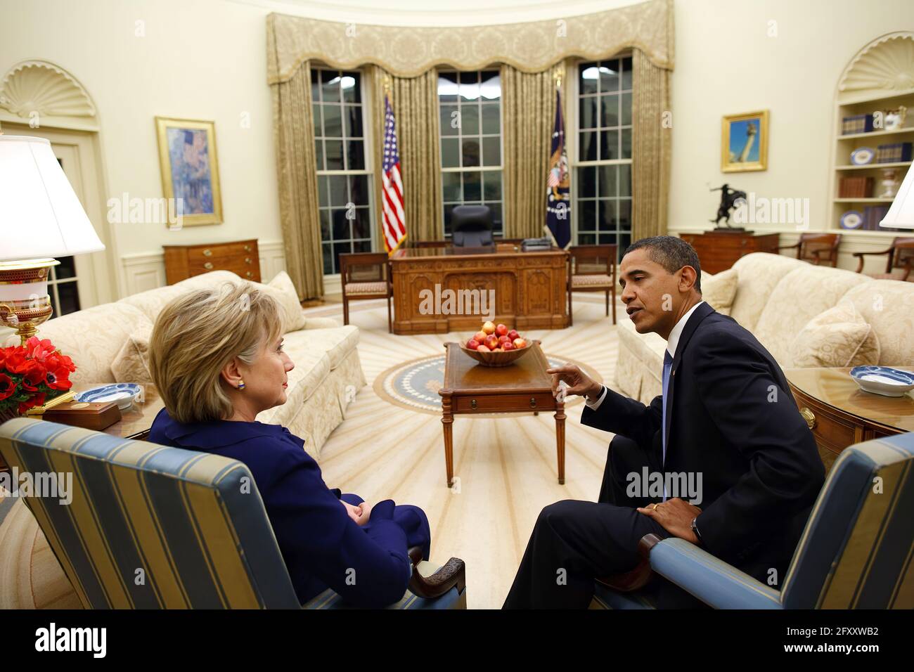 President Barack Obama meets with Secretary of State Hillary Clinton in the Oval Office shortly after she was confirmed and sworn in on Wednesday, Jan. 21, 2009. Official White House Photo by Pete Souza Stock Photo