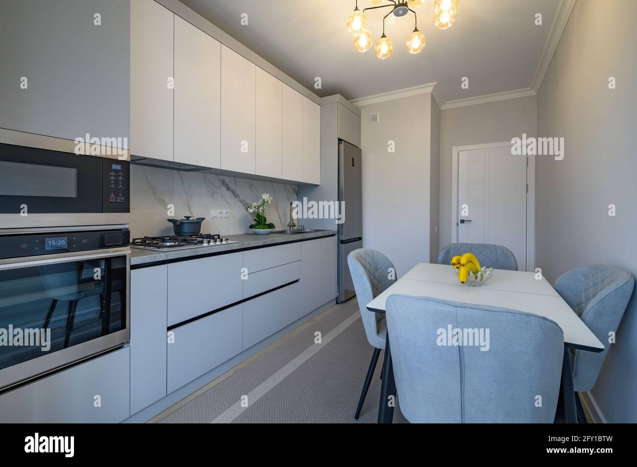 Modern gray and white kitchen interior Stock Photo Alamy