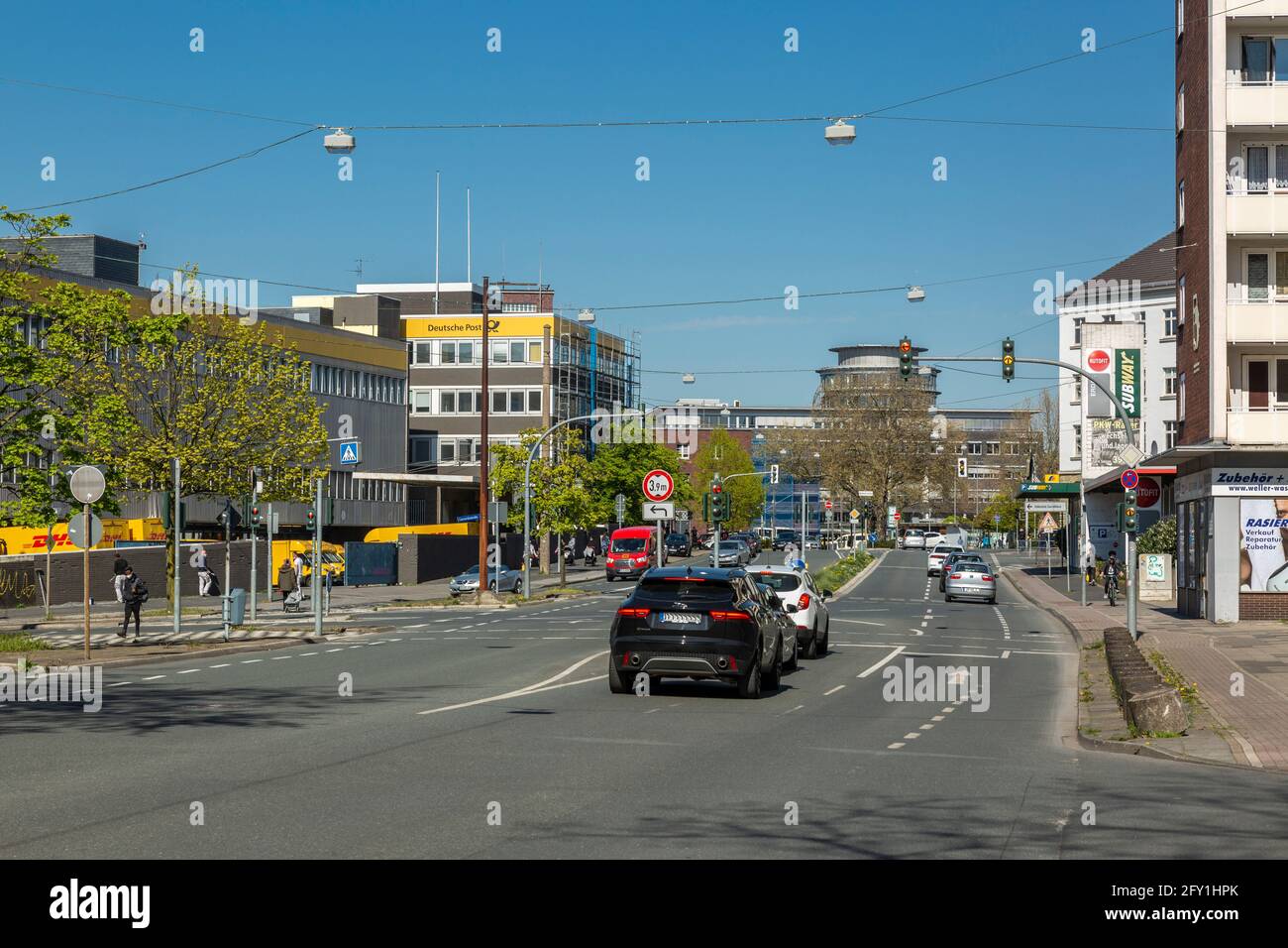 Germany, Oberhausen, Alt-Oberhausen, Ruhr area, Lower Rhine, Rhineland, North Rhine-Westphalia, NRW, view along the Friedrich Karl Strasse towards German Post and Central Station and also to the Labour Court Oberhausen, cars on the main road Stock Photo