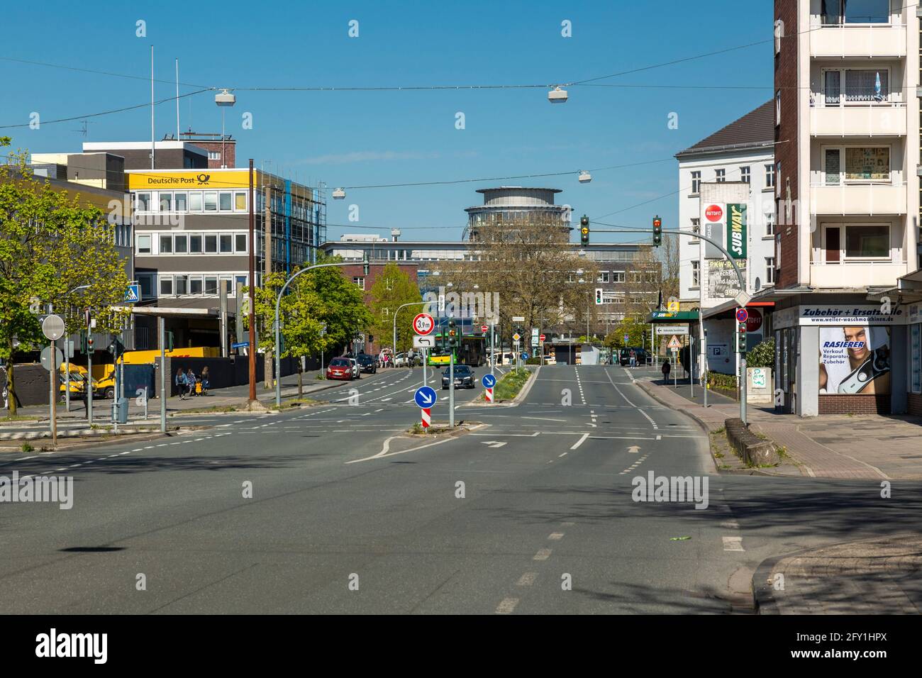 Germany, Oberhausen, Alt-Oberhausen, Ruhr area, Lower Rhine, Rhineland, North Rhine-Westphalia, NRW, view along the Friedrich Karl Strasse towards German Post and Central Station and also to the Labour Court Oberhausen, cars on the main road Stock Photo
