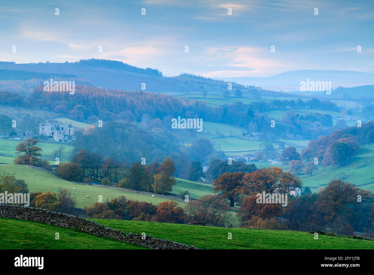 Scenic rural Wharfedale (mist, valley, hillsides, upland fells & moors, Barden Bridge, Tower ruins) - Bolton Abbey Estate, Yorkshire Dales, England UK Stock Photo