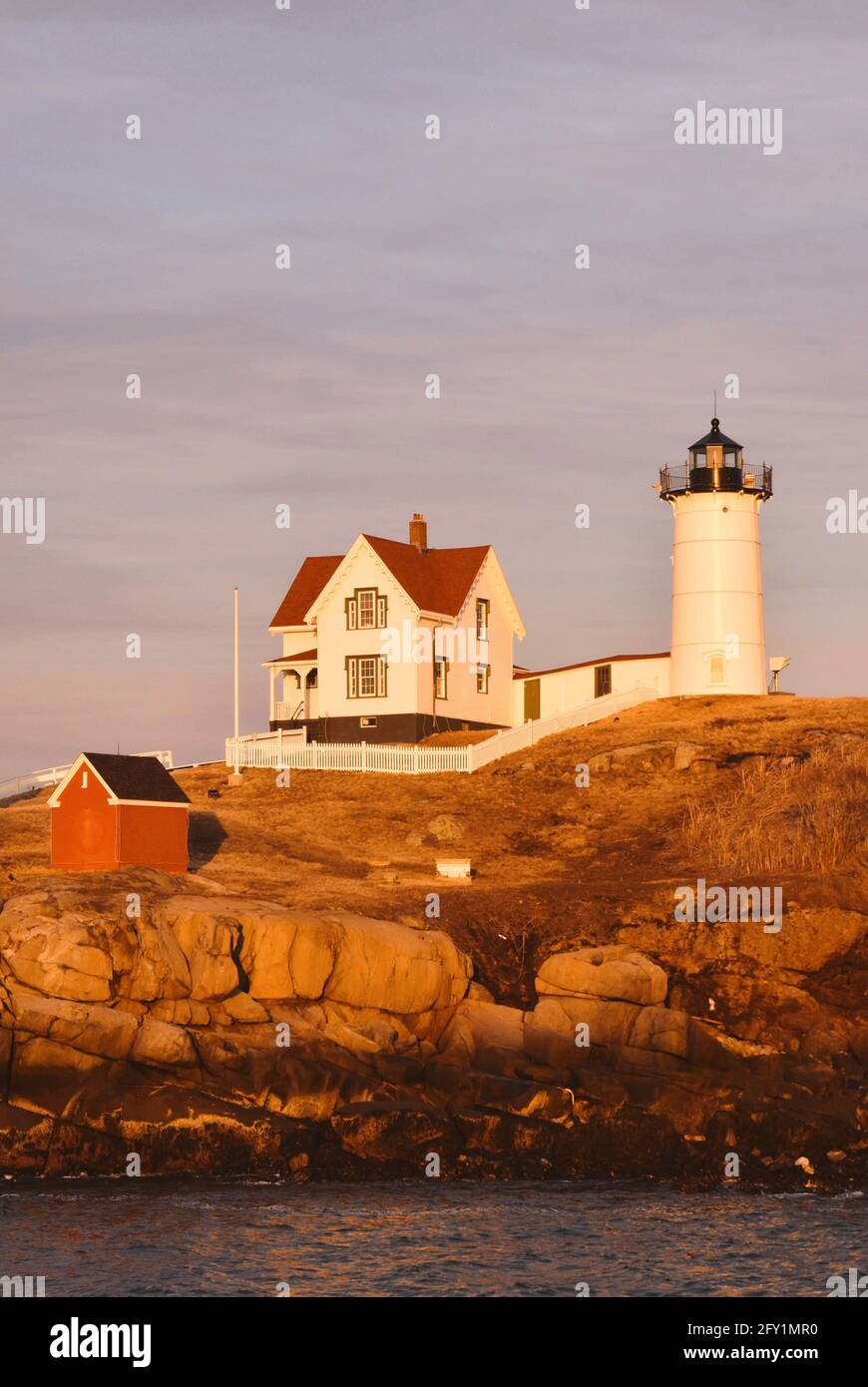 Across channel view of Nubble Lighthouse at sunset in York, ME, USA Stock Photo