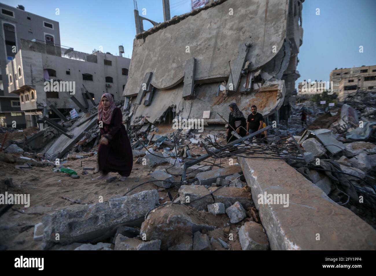 A Palestinian family lives in a tent on the rubble of their destroyed ...
