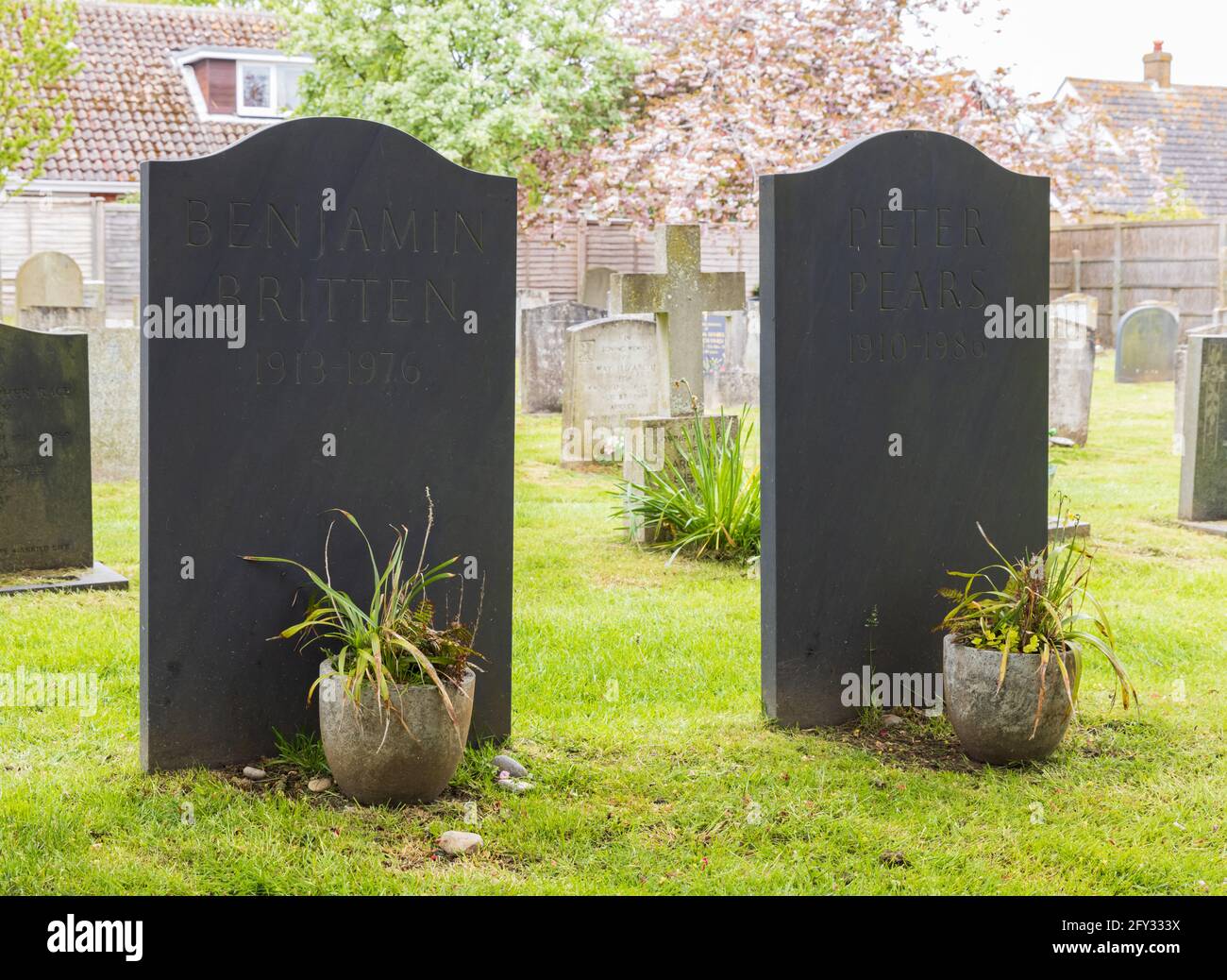The headstones and resting place of composer Benjamin Britten and Peter Pears in the cemetery of St Peter and St Paul's Church, Aldeburgh, Suffolk. UK Stock Photo